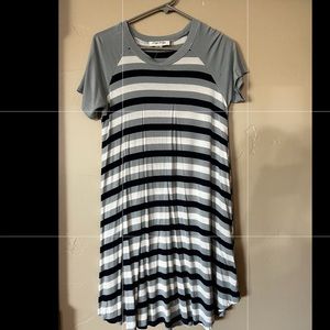 A flowy striped dress. NEVER BEEN WORN